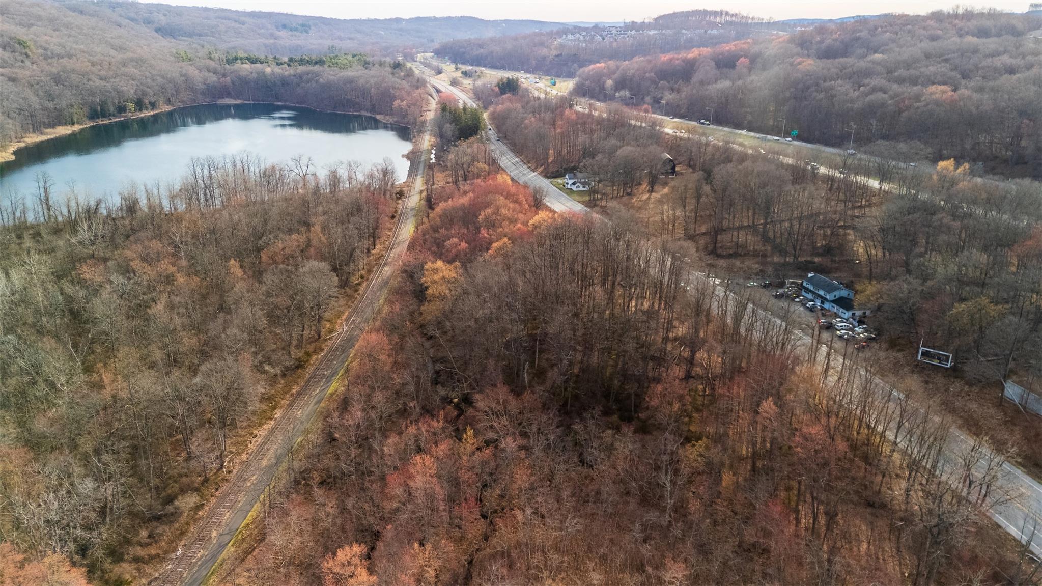 3918 Danbury Road Brewster, NY 10509 - Photo 11 of 26 Bird's eye view with a water view and a forest view