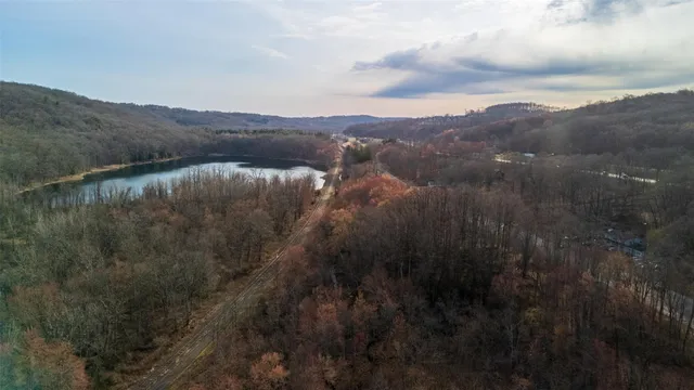 a view of a lake in middle of forest