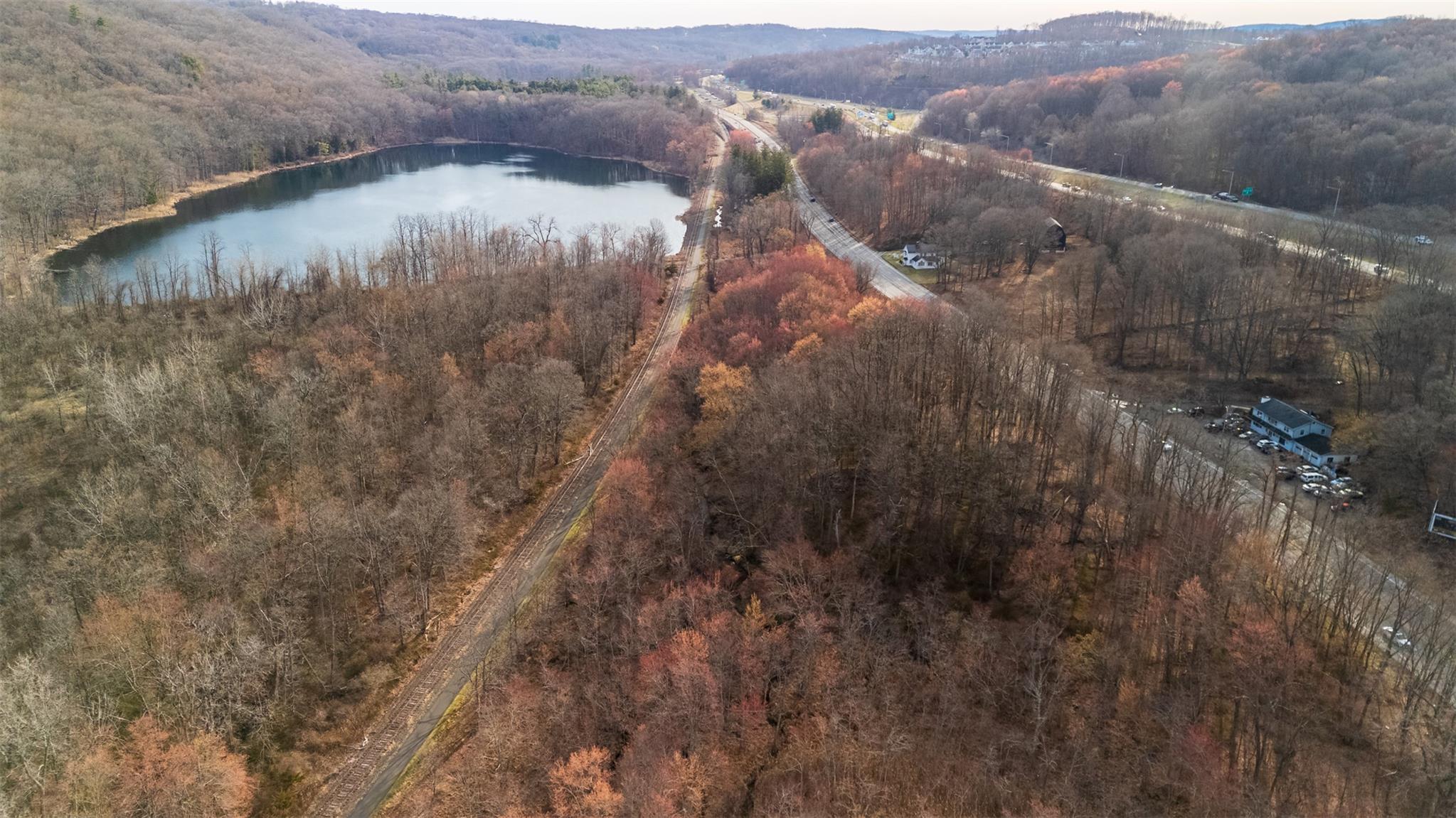 3918 Danbury Road Brewster, NY 10509 - Photo 8 of 26 Bird's eye view with a water view and a wooded view