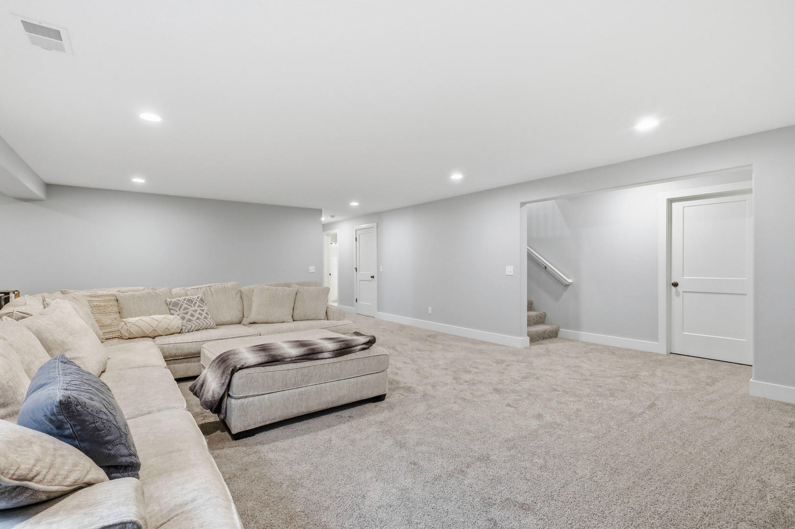 6779 Genesis Way Bettendorf, IA 52722 - Photo 28 of 36 a living room with furniture and a couch
