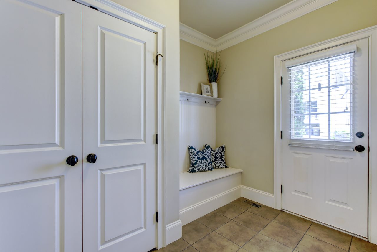 226 Penley Circle Raleigh, NC 27609 - Photo 8 of 14 It's easy to stay organized in this beautiful town home. Enjoy exploring the outdoors Midtown has to offer and return home through this useful Mud Room rear door entry featuring direct access to the laundry area and a large double door closet. Mud Room
