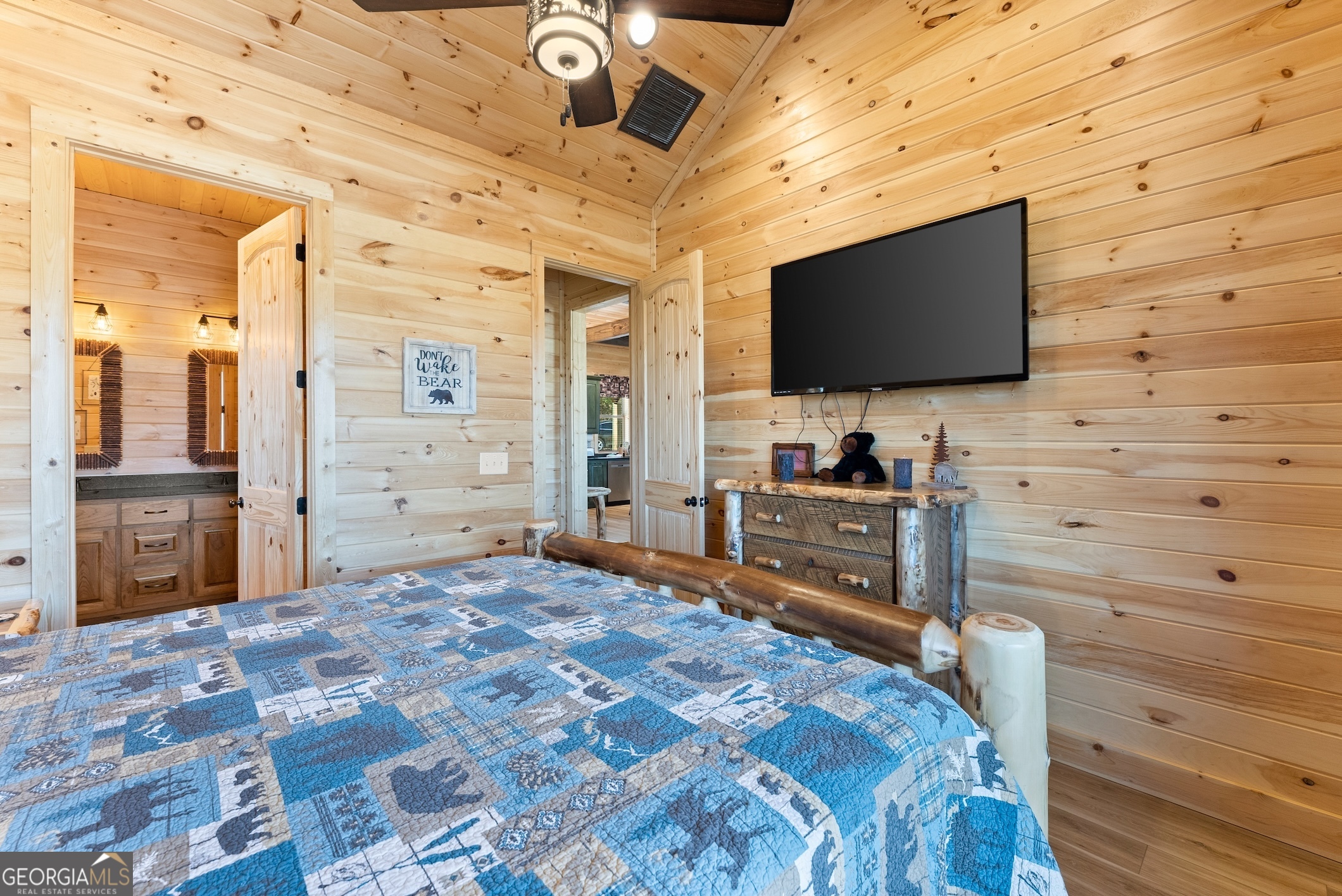 473 Monroe Ridge Road Sautee Nacoochee, GA 30571 - Photo 13 of 63 a bedroom with a bed and a flat screen tv