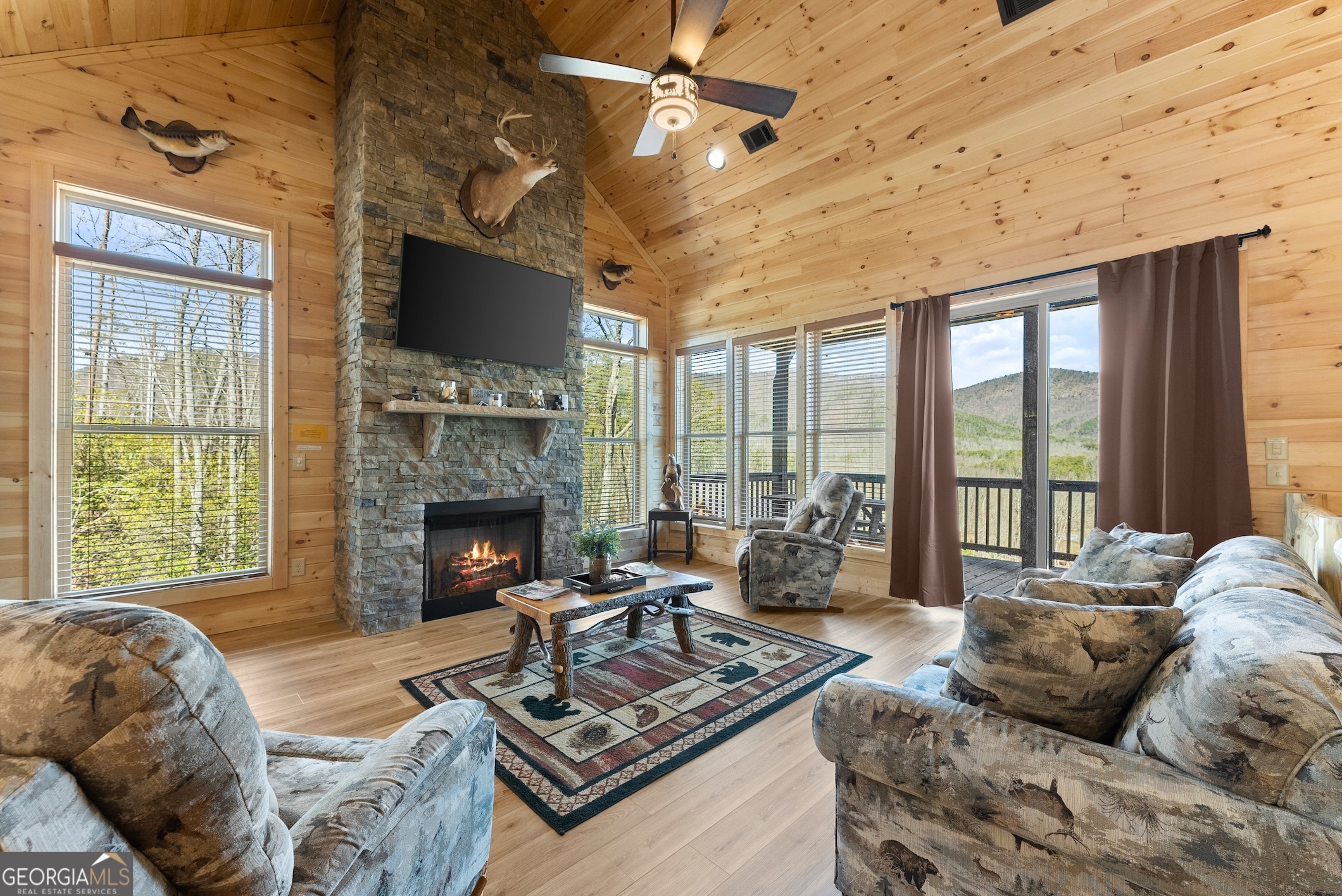 473 Monroe Ridge Road Sautee Nacoochee, GA 30571 - Photo 14 of 63 a living room with furniture fireplace and a flat screen tv