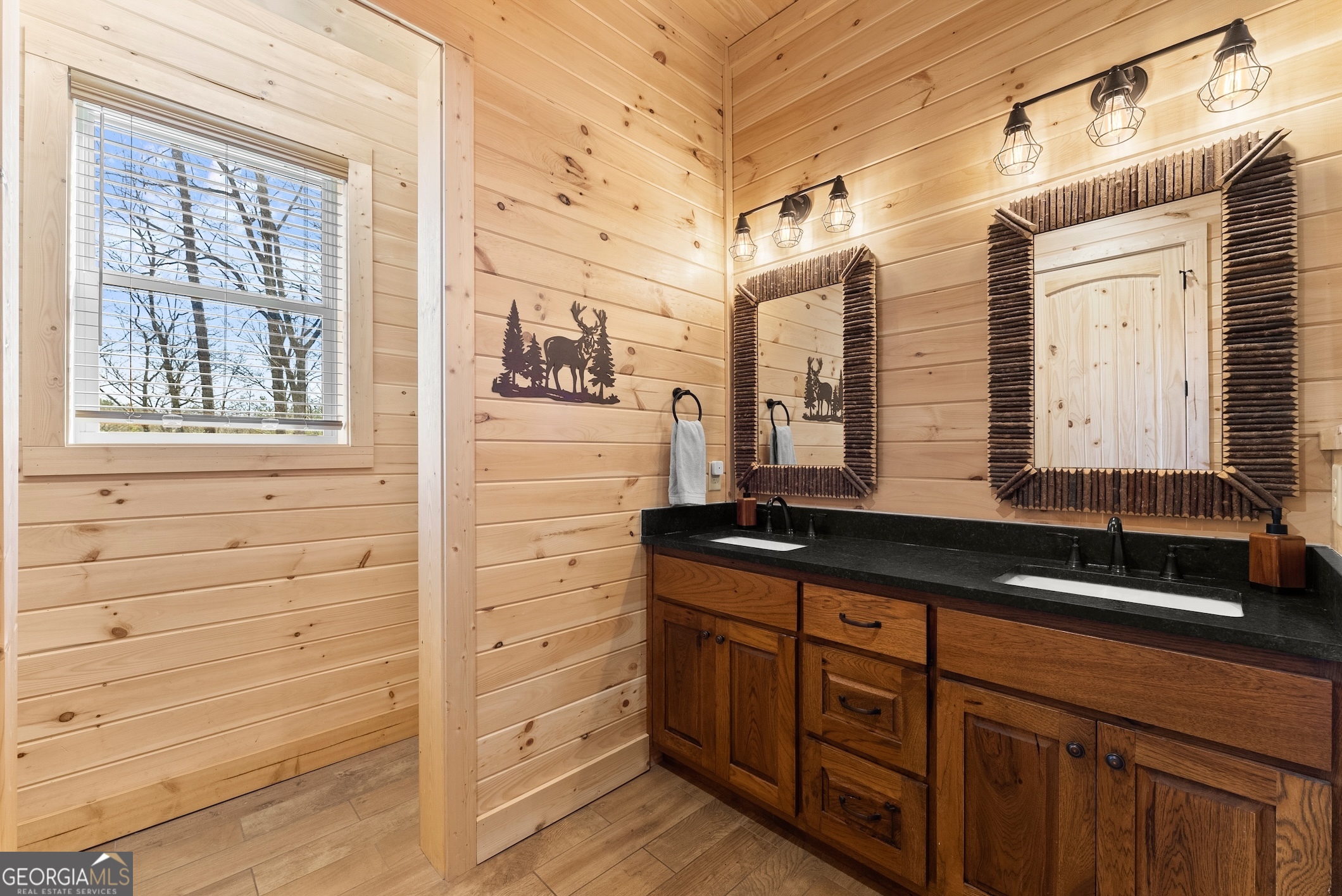 473 Monroe Ridge Road Sautee Nacoochee, GA 30571 - Photo 15 of 63 a bathroom with a granite countertop sink and a mirror