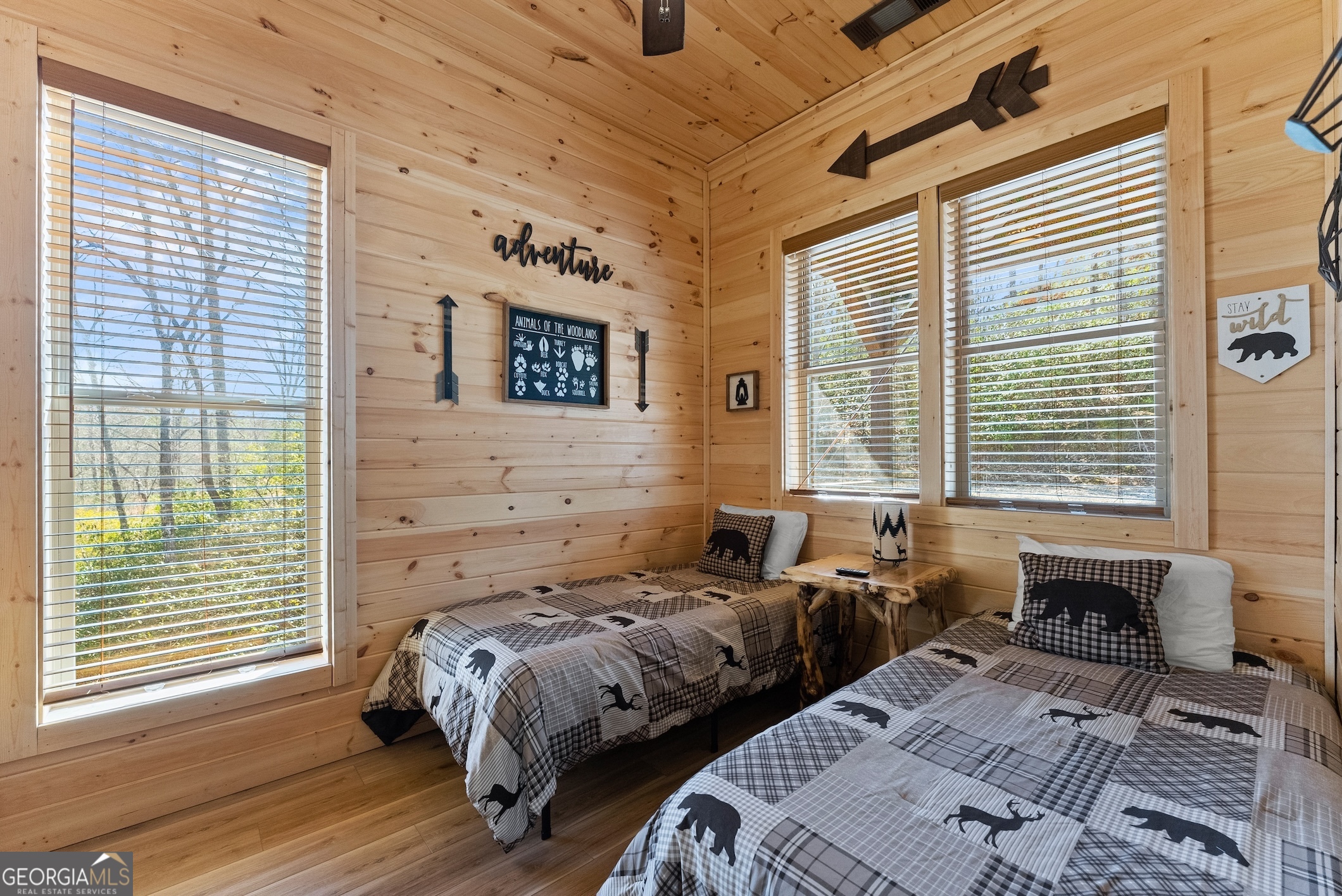 473 Monroe Ridge Road Sautee Nacoochee, GA 30571 - Photo 17 of 63 a bed sitting in a bedroom next to a window