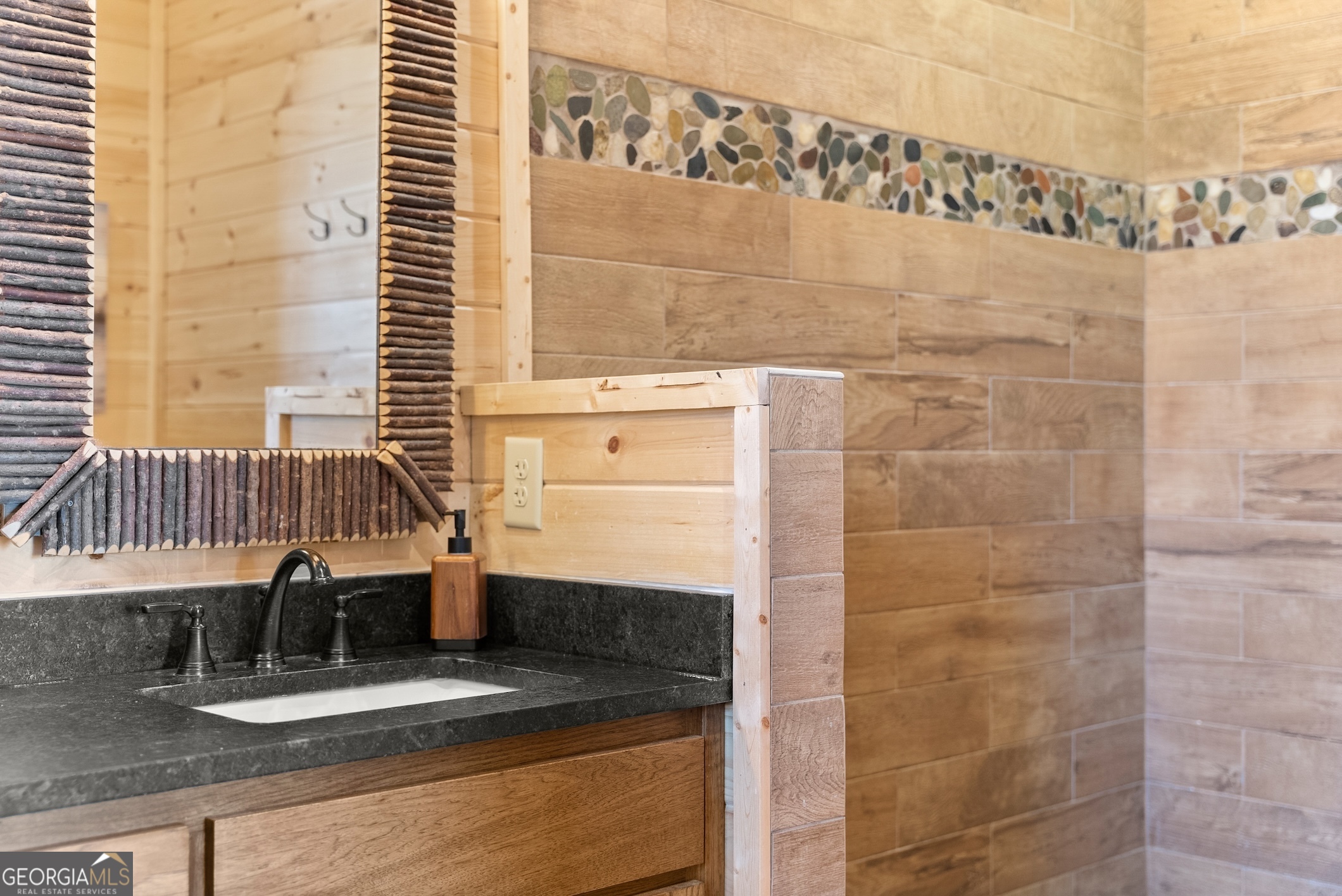 473 Monroe Ridge Road Sautee Nacoochee, GA 30571 - Photo 25 of 63 a bathroom with a granite countertop sink a mirror and shower