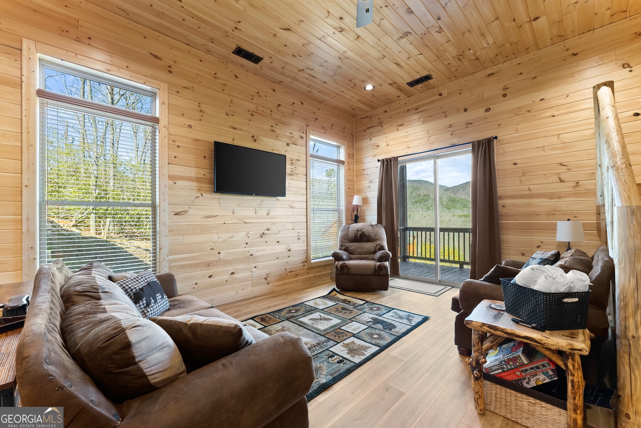 473 Monroe Ridge Road Sautee Nacoochee, GA 30571 - Photo 27 of 63 a living room with furniture and a flat screen tv