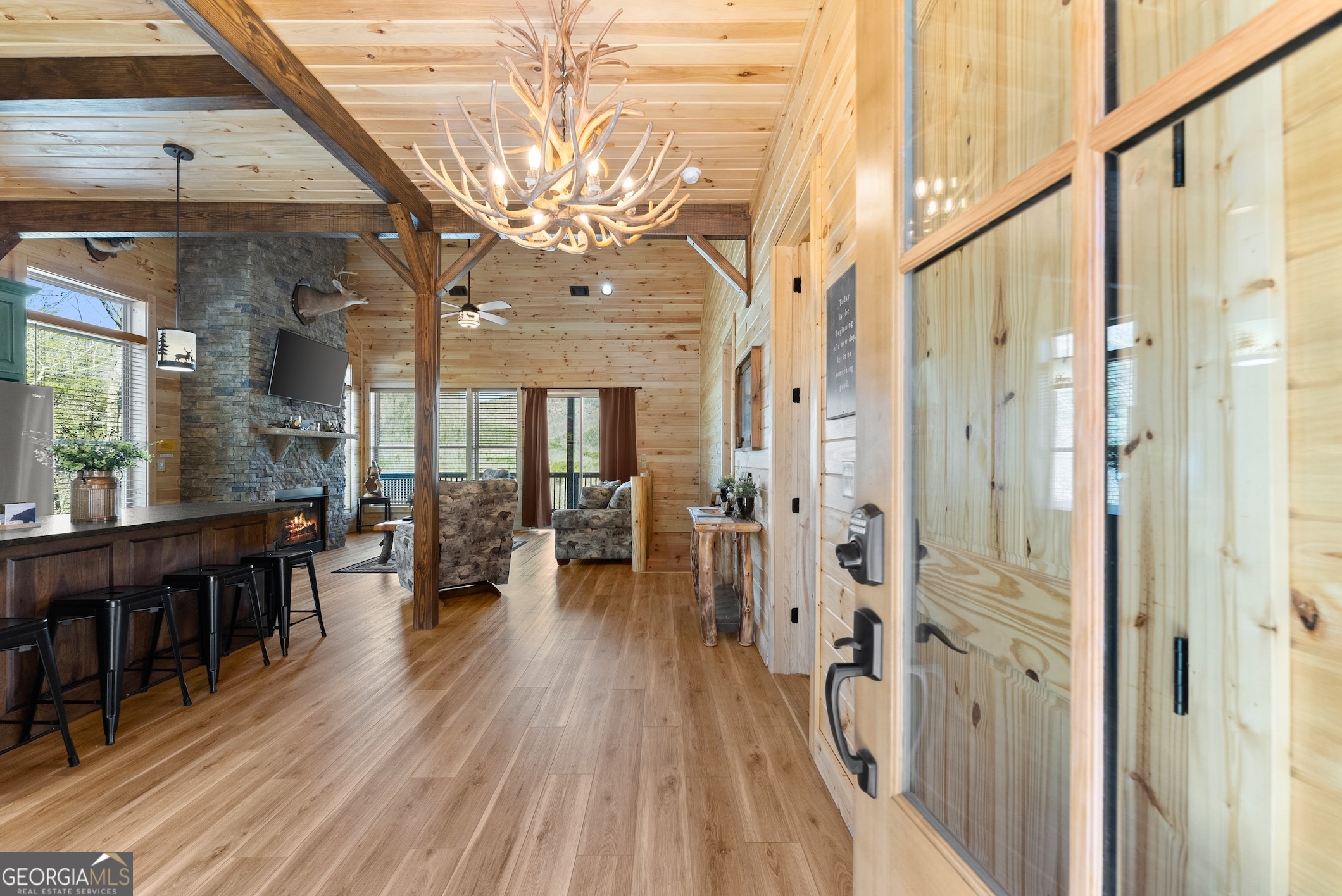 473 Monroe Ridge Road Sautee Nacoochee, GA 30571 - Photo 3 of 63 a view of a big room with wooden floor and furniture