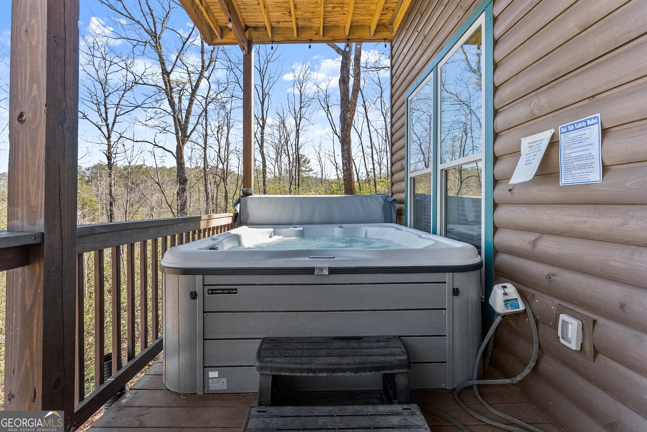 473 Monroe Ridge Road Sautee Nacoochee, GA 30571 - Photo 41 of 63 a view of a house with backyard and wooden fence