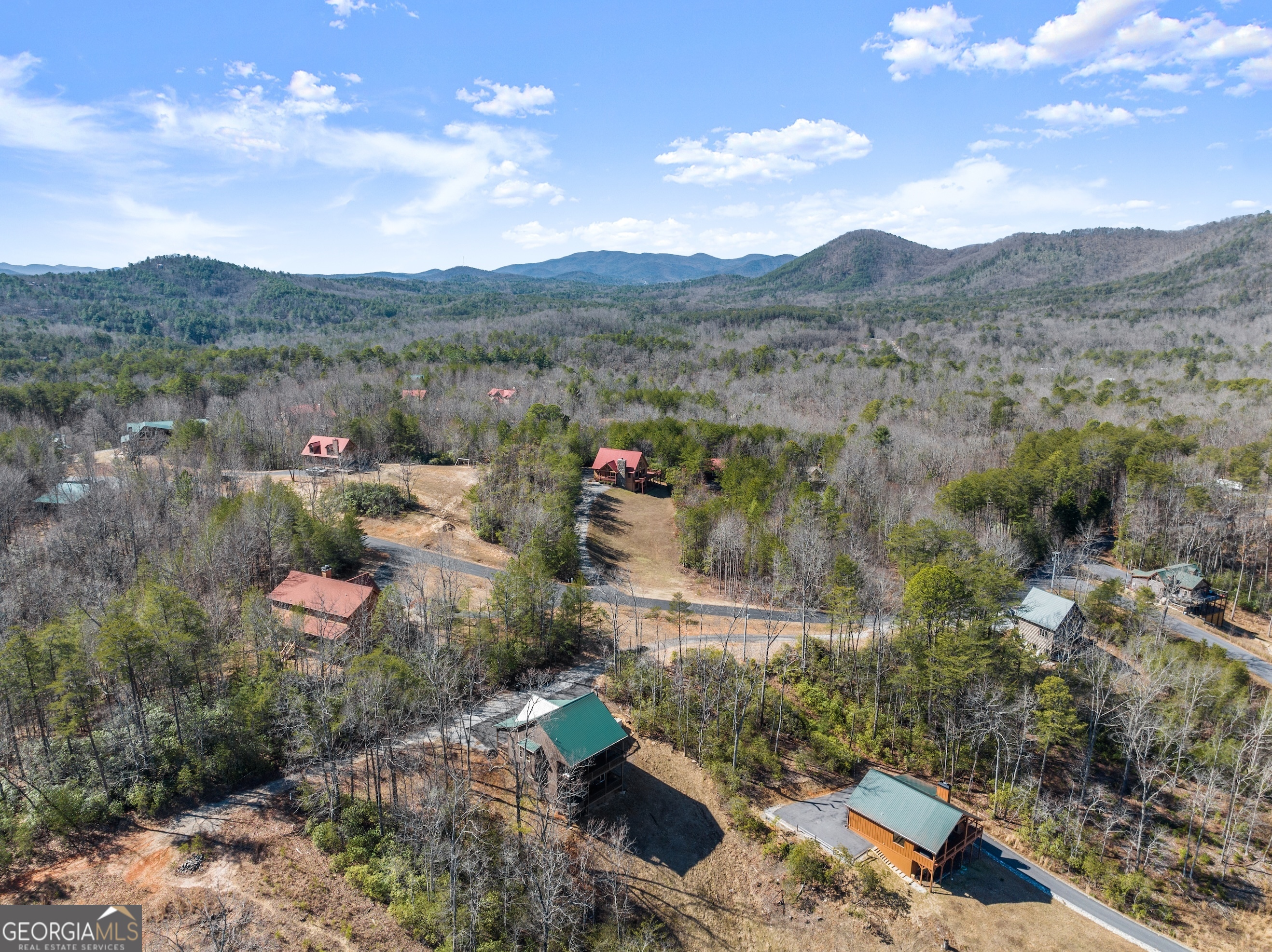 473 Monroe Ridge Road Sautee Nacoochee, GA 30571 - Photo 44 of 63 a view of a town with mountains in the background