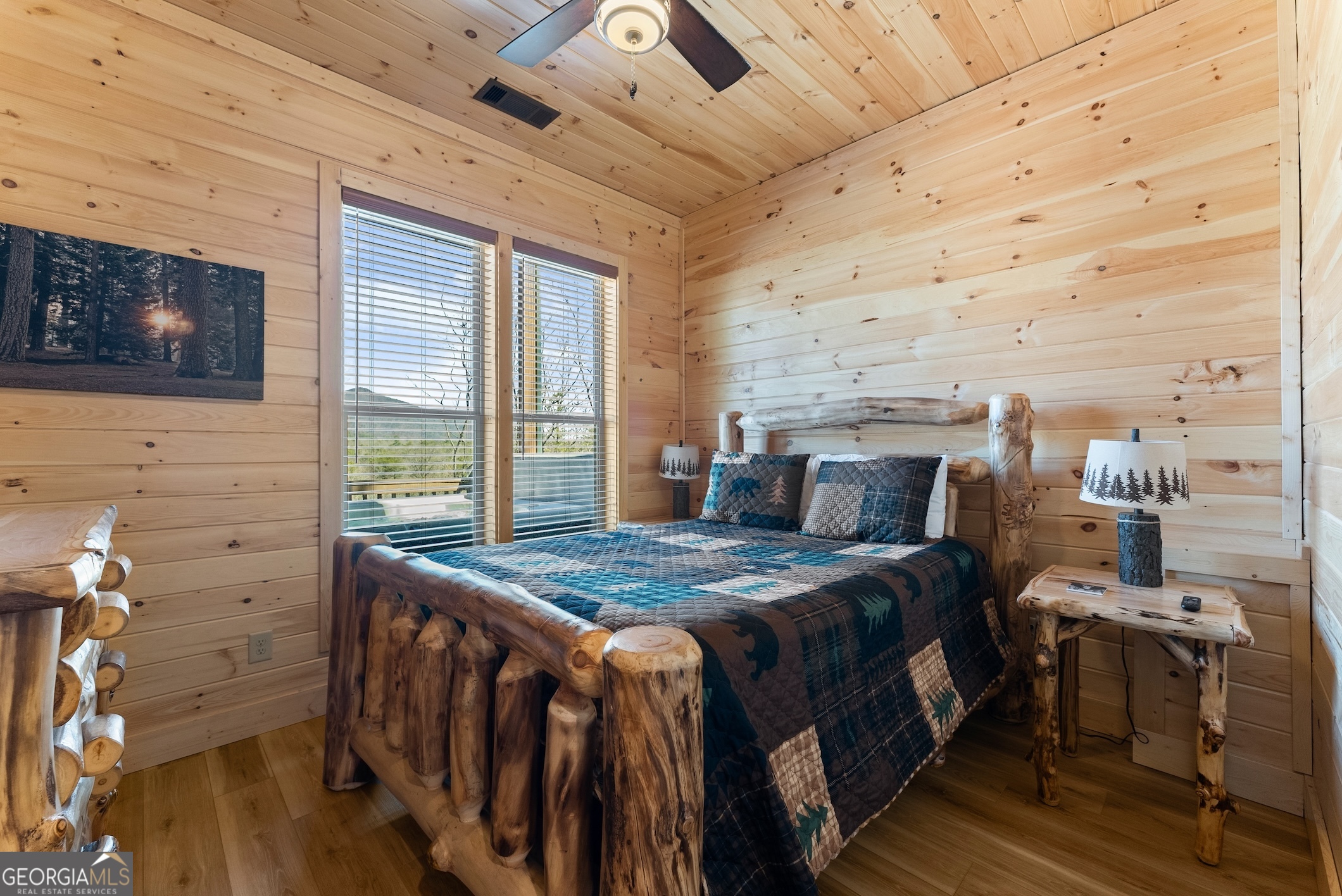 473 Monroe Ridge Road Sautee Nacoochee, GA 30571 - Photo 49 of 63 a bedroom with a bed and wooden floor