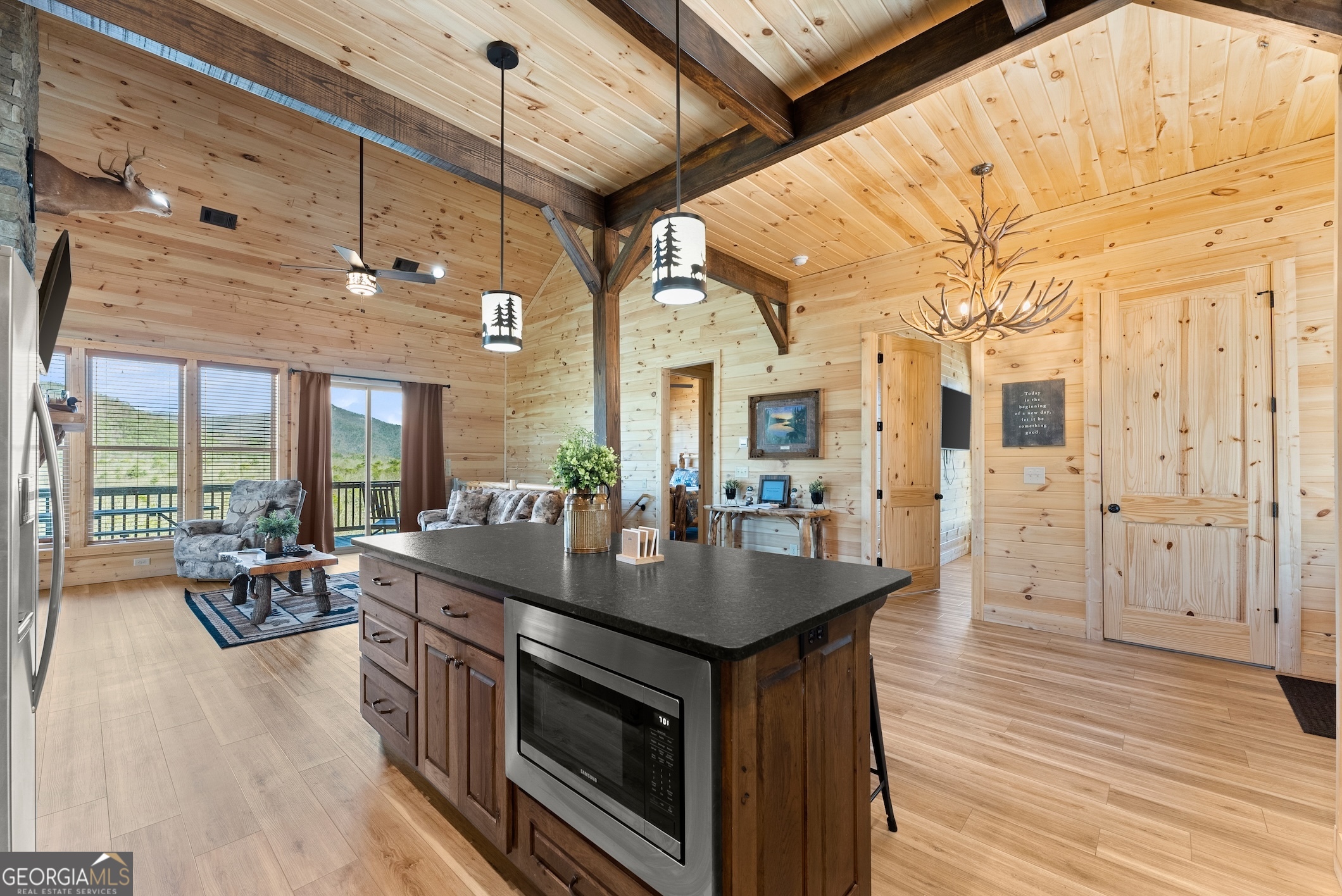 473 Monroe Ridge Road Sautee Nacoochee, GA 30571 - Photo 54 of 63 a kitchen with stainless steel appliances granite countertop a stove and a wooden floors