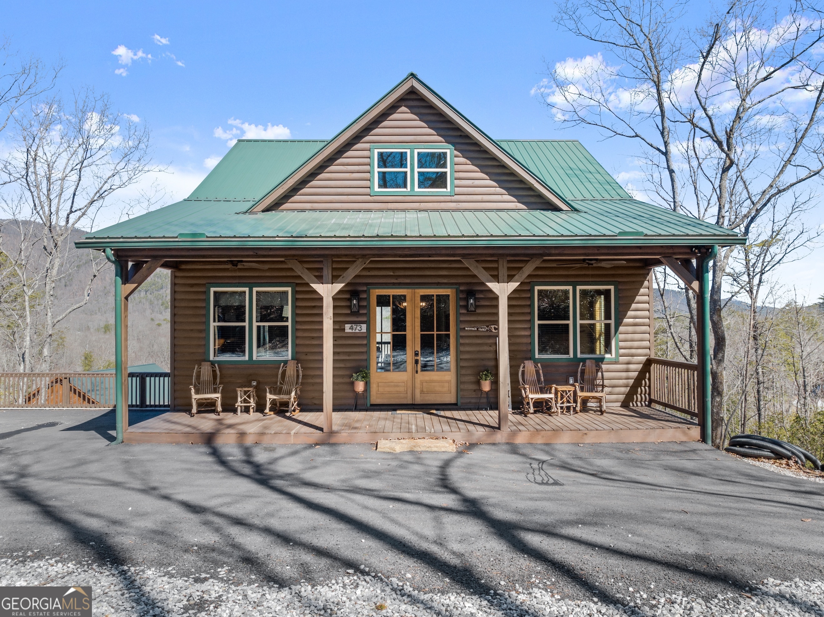 473 Monroe Ridge Road Sautee Nacoochee, GA 30571 - Photo 59 of 63 a front view of a house with a yard outdoor seating and barbeque oven