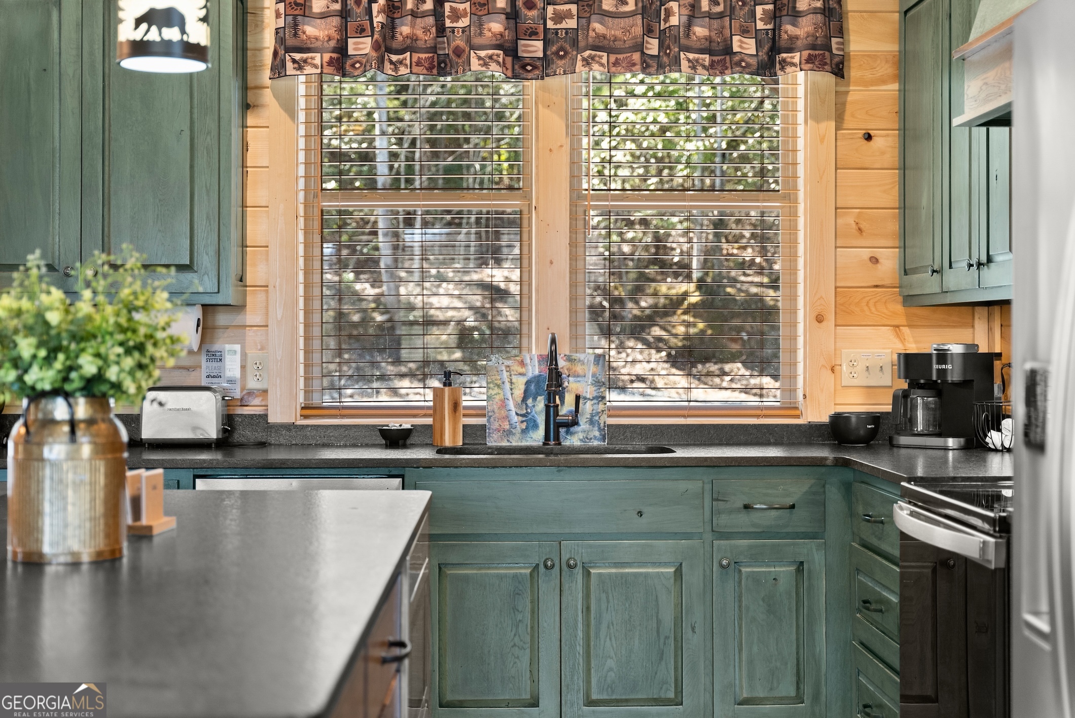 473 Monroe Ridge Road Sautee Nacoochee, GA 30571 - Photo 6 of 63 a kitchen with granite countertop a sink and a window