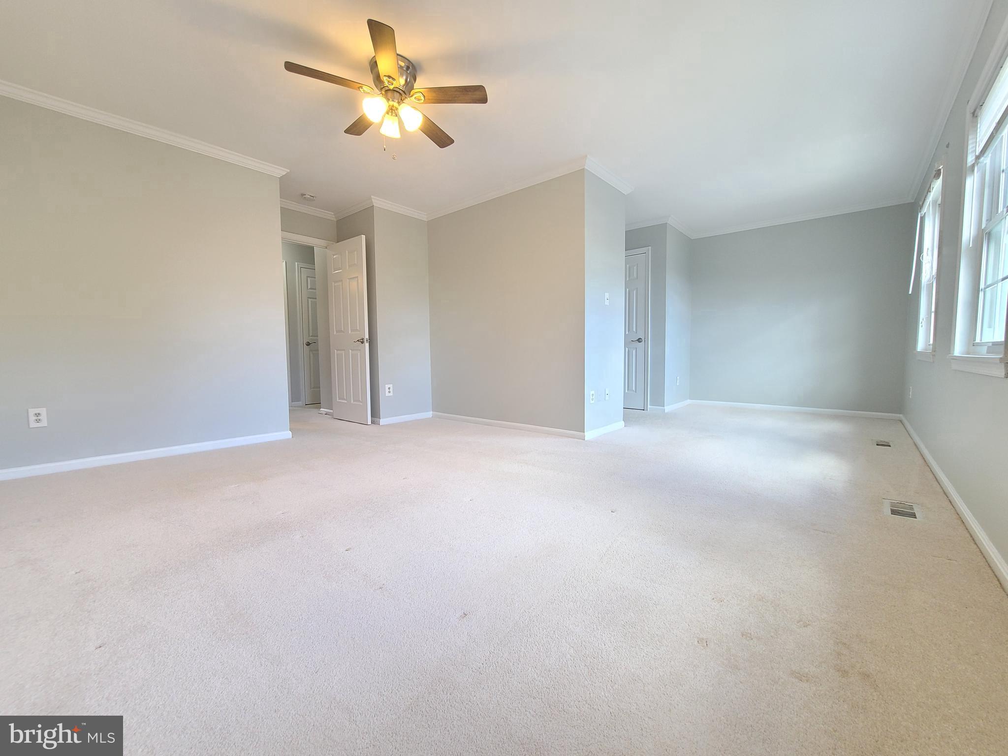 6644 Green Ash Drive Springfield, VA 22152 - Photo 21 of 42 a view of a livingroom with a ceiling fan and window