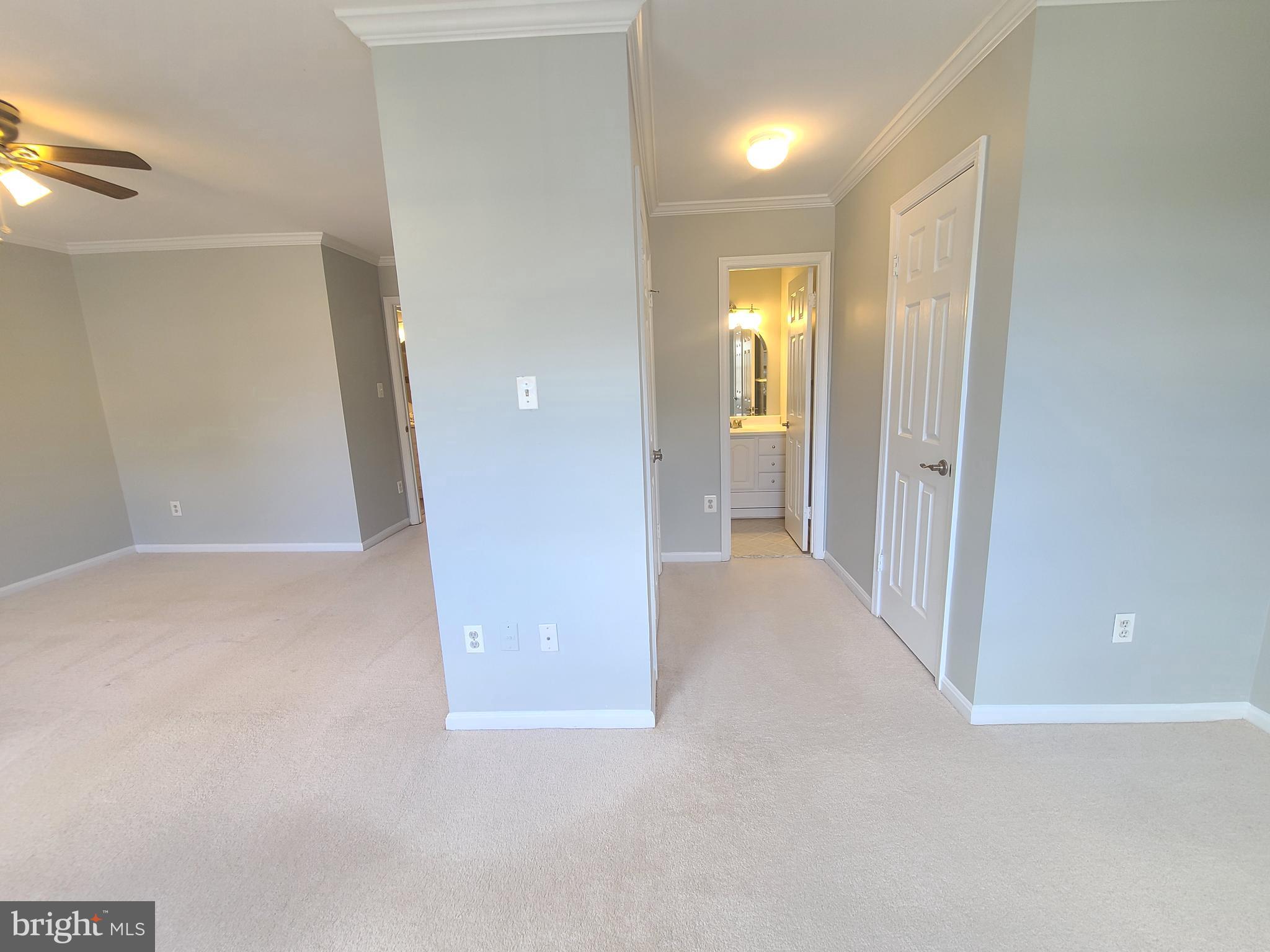6644 Green Ash Drive Springfield, VA 22152 - Photo 22 of 42 a view of a hallway with wooden shelves