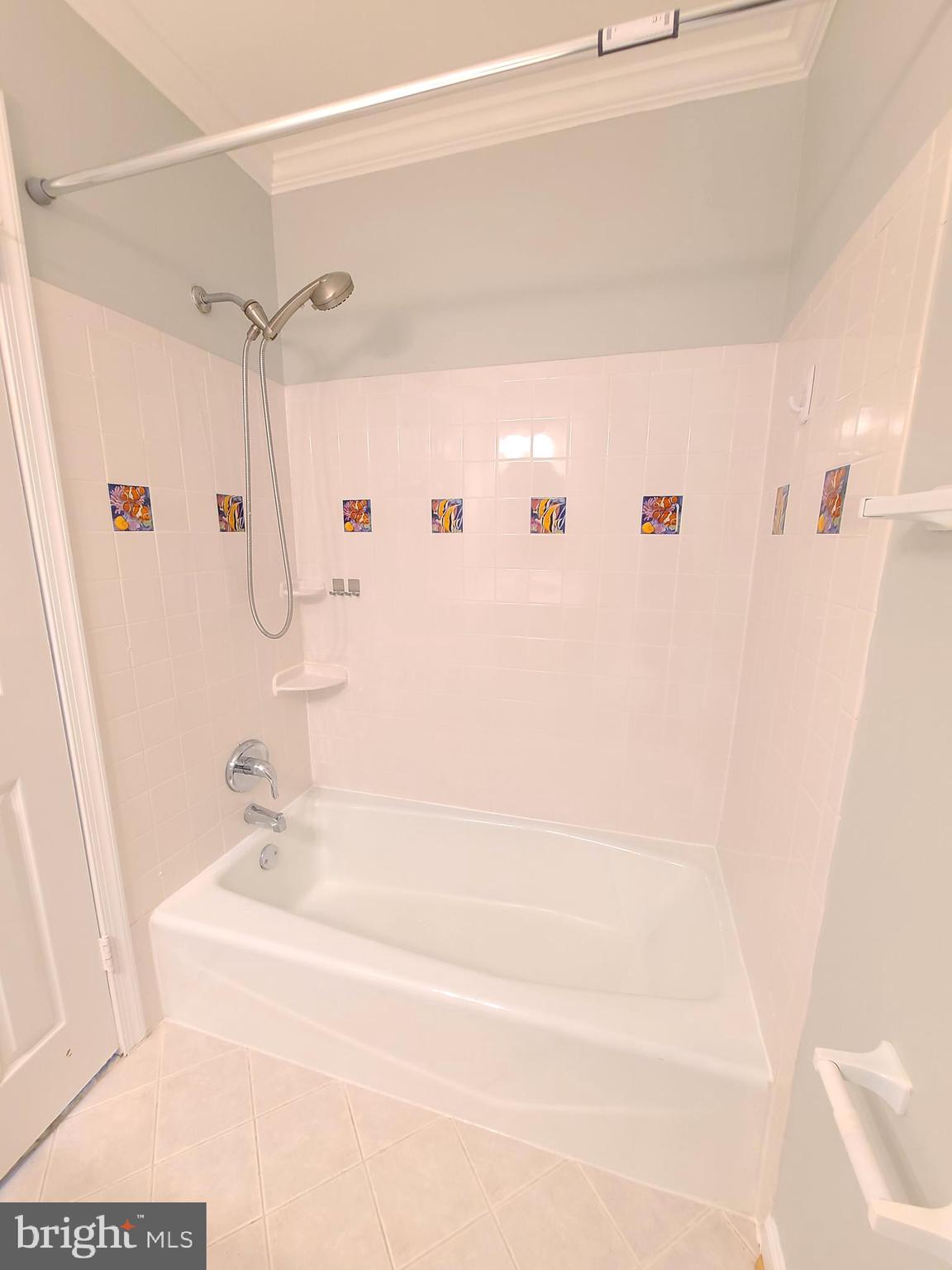 6644 Green Ash Drive Springfield, VA 22152 - Photo 30 of 42 a bathroom with a bathtub and a shower