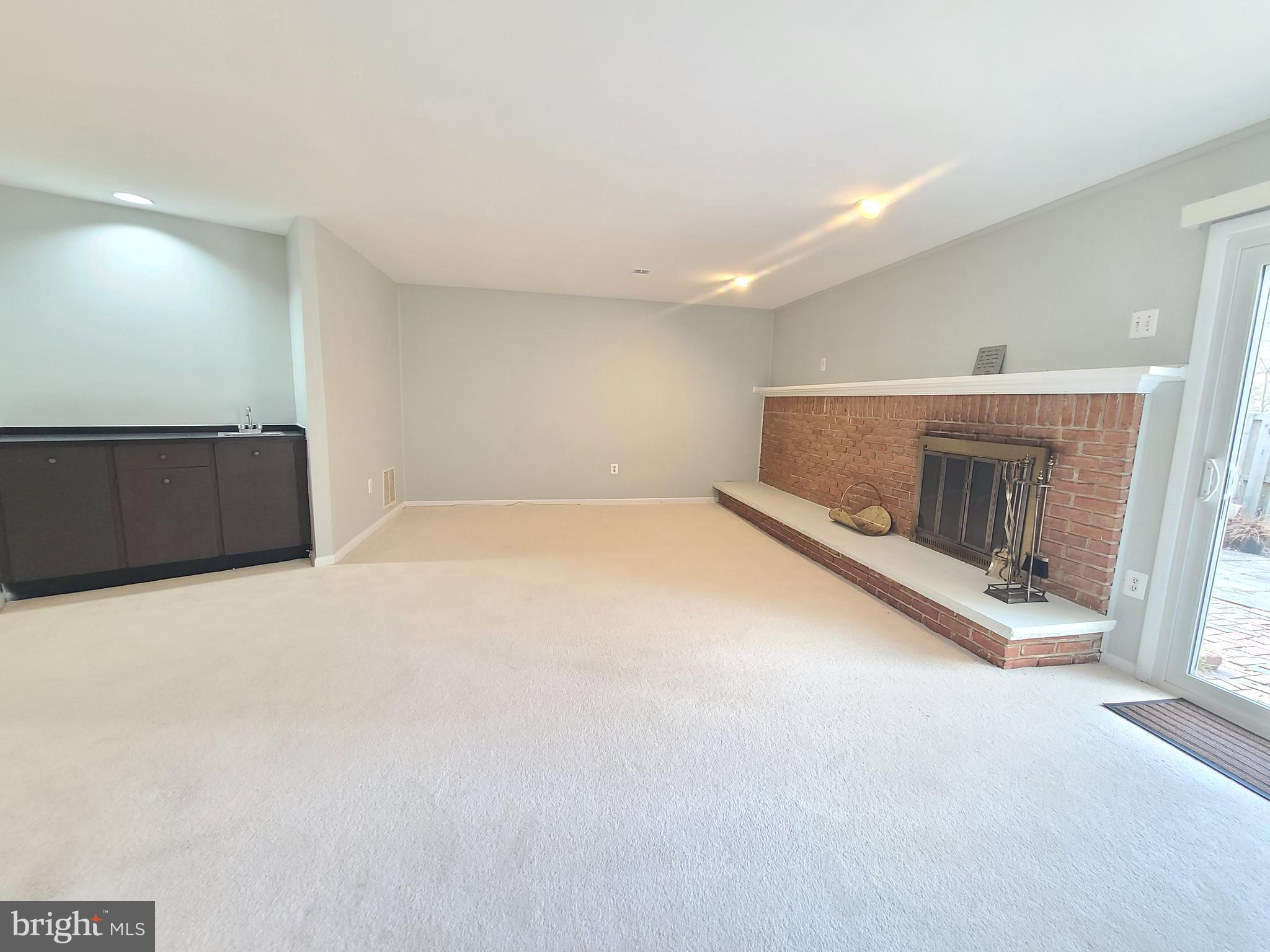 6644 Green Ash Drive Springfield, VA 22152 - Photo 36 of 42 a view of an empty room with a fireplace