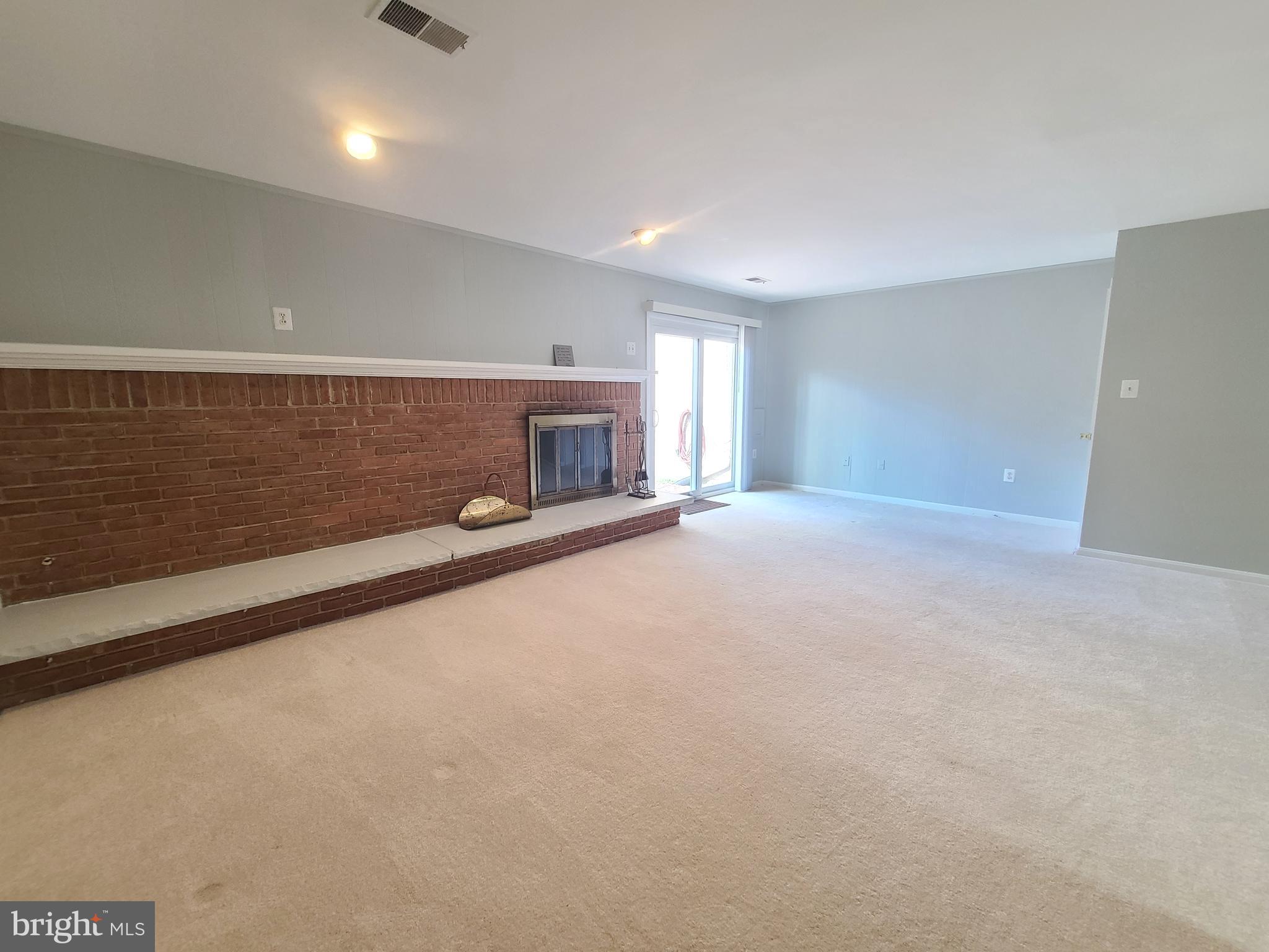 6644 Green Ash Drive Springfield, VA 22152 - Photo 39 of 42 a view of an empty room with a fireplace