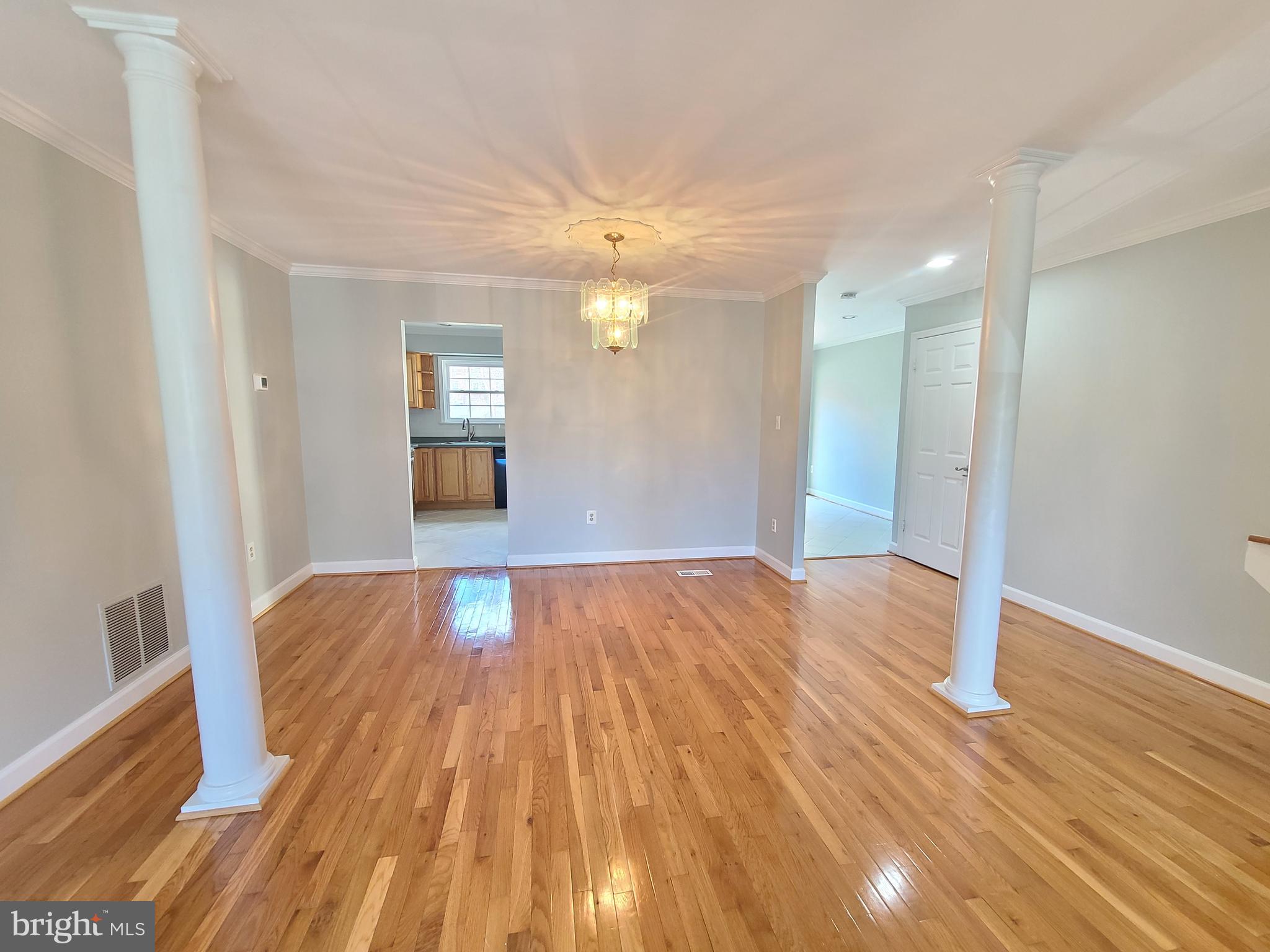 6644 Green Ash Drive Springfield, VA 22152 - Photo 9 of 42 a view of empty room with wooden floor and fan