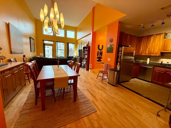 a view of a dining room with furniture and window