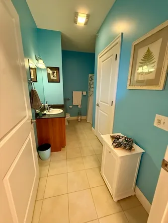 a room with furniture a air conditioner vent and a window