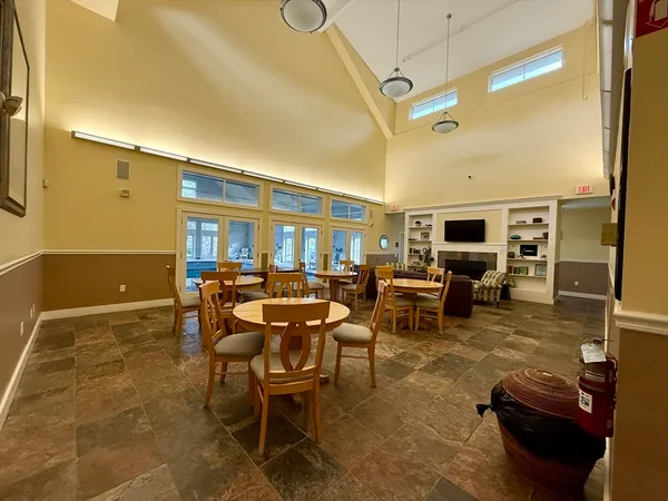 a living room with furniture and flat screen tv