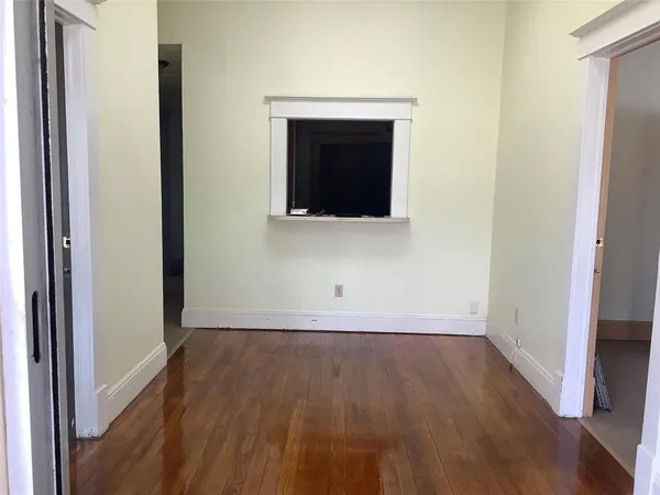 a view of a livingroom with wooden floor