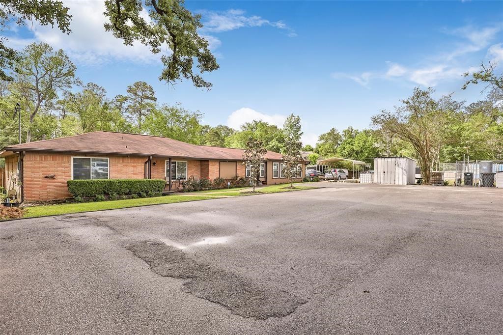5302 Treaschwig Road Spring, TX 77373 - Photo 1 of 41 a front view of a house with a yard and garage