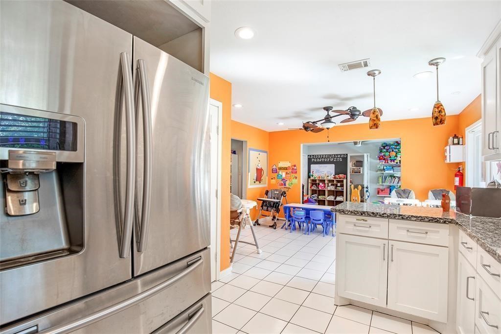 5302 Treaschwig Road Spring, TX 77373 - Photo 16 of 41 a kitchen with stainless steel appliances granite countertop a refrigerator and a stove