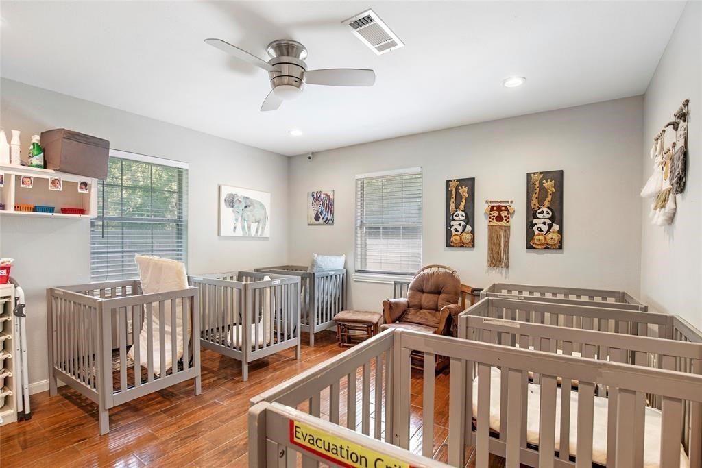 5302 Treaschwig Road Spring, TX 77373 - Photo 19 of 41 a bedroom with furniture and wooden floor