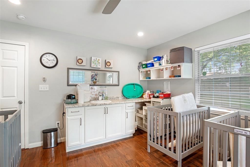 5302 Treaschwig Road Spring, TX 77373 - Photo 20 of 41 a room with furniture a clock and a window