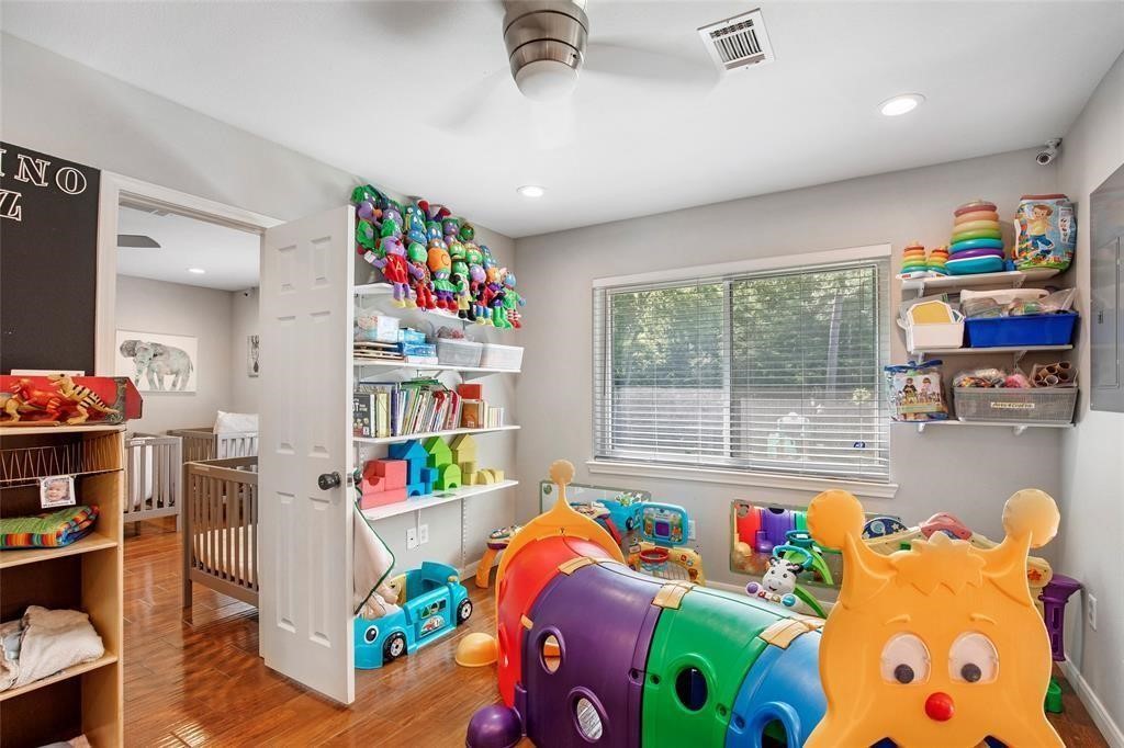 5302 Treaschwig Road Spring, TX 77373 - Photo 21 of 41 a room with furniture toys and a large window