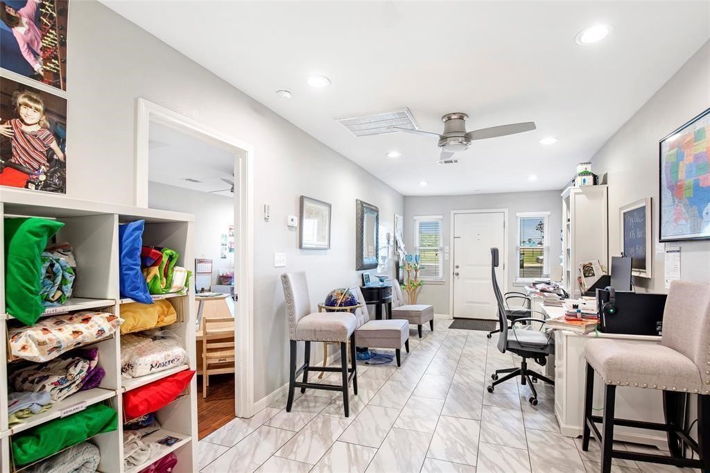 5302 Treaschwig Road Spring, TX 77373 - Photo 25 of 41 a living room with furniture and a chandelier