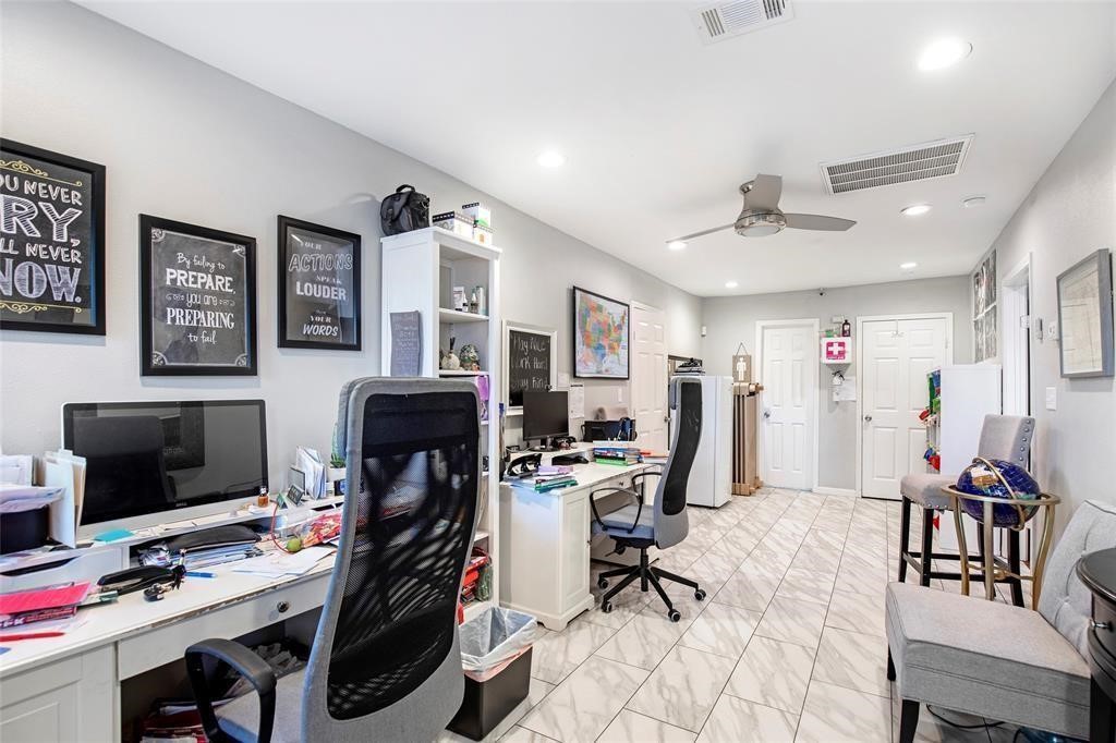 5302 Treaschwig Road Spring, TX 77373 - Photo 26 of 41 a view of a workspace with furniture and gym equipment