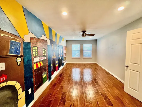 a view of an entryway with wooden floor