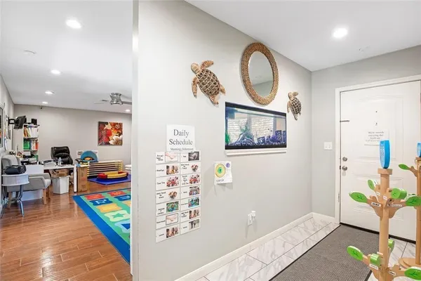 an entryway with furniture and wooden floor
