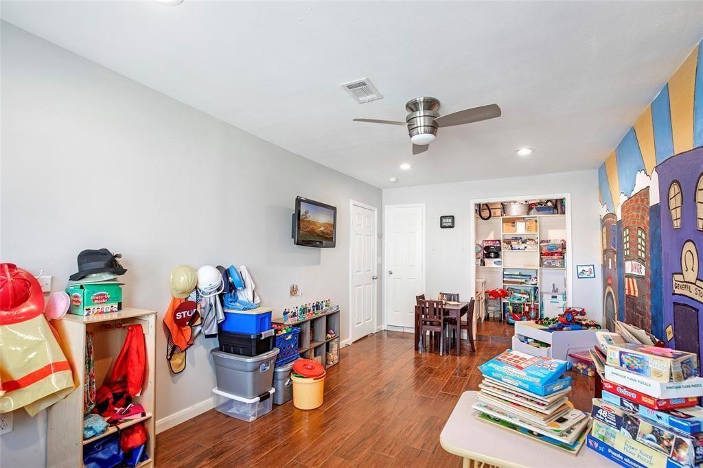 5302 Treaschwig Road Spring, TX 77373 - Photo 32 of 41 a living room with furniture and a flat screen tv