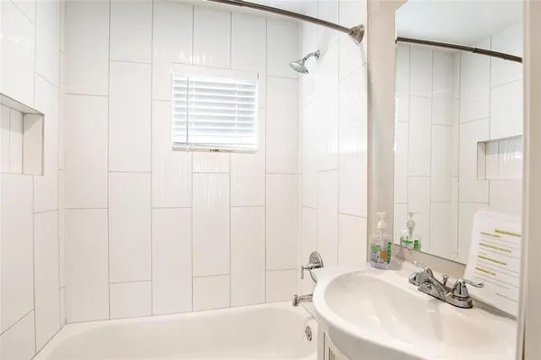 a bathroom with a sink and a bathtub
