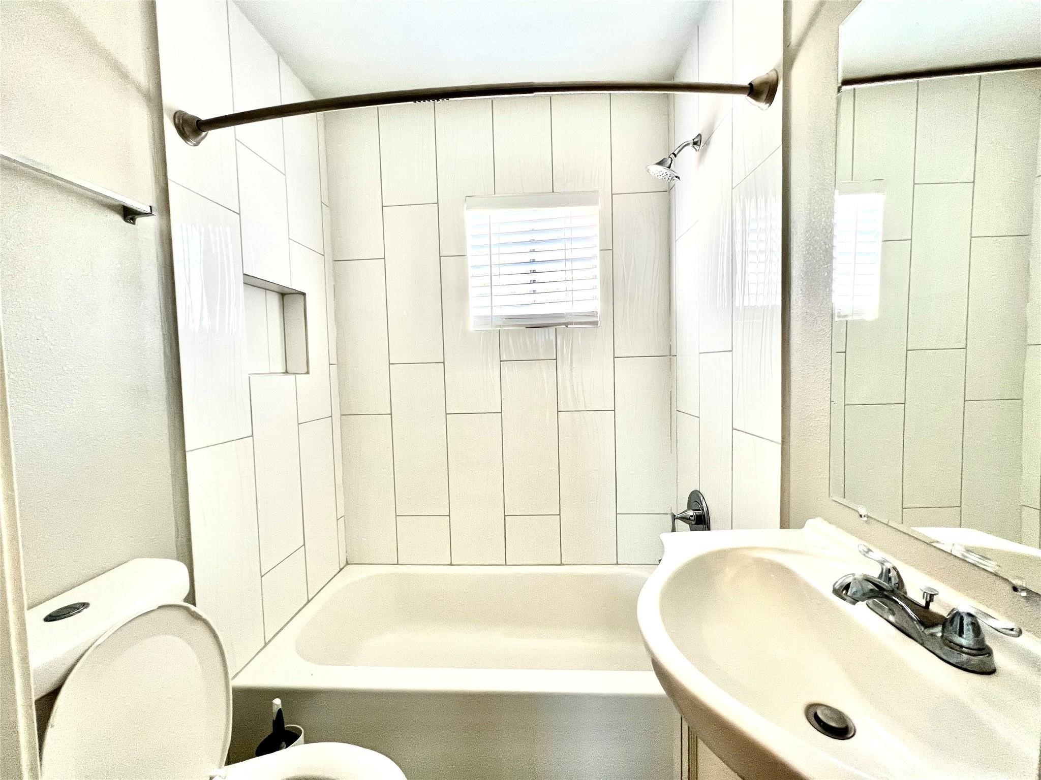 5302 Treaschwig Road Spring, TX 77373 - Photo 39 of 41 a bathroom with a sink and a bathtub