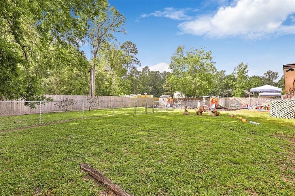 5302 Treaschwig Road Spring, TX 77373 - Photo 40 of 41 a view of a field with large trees