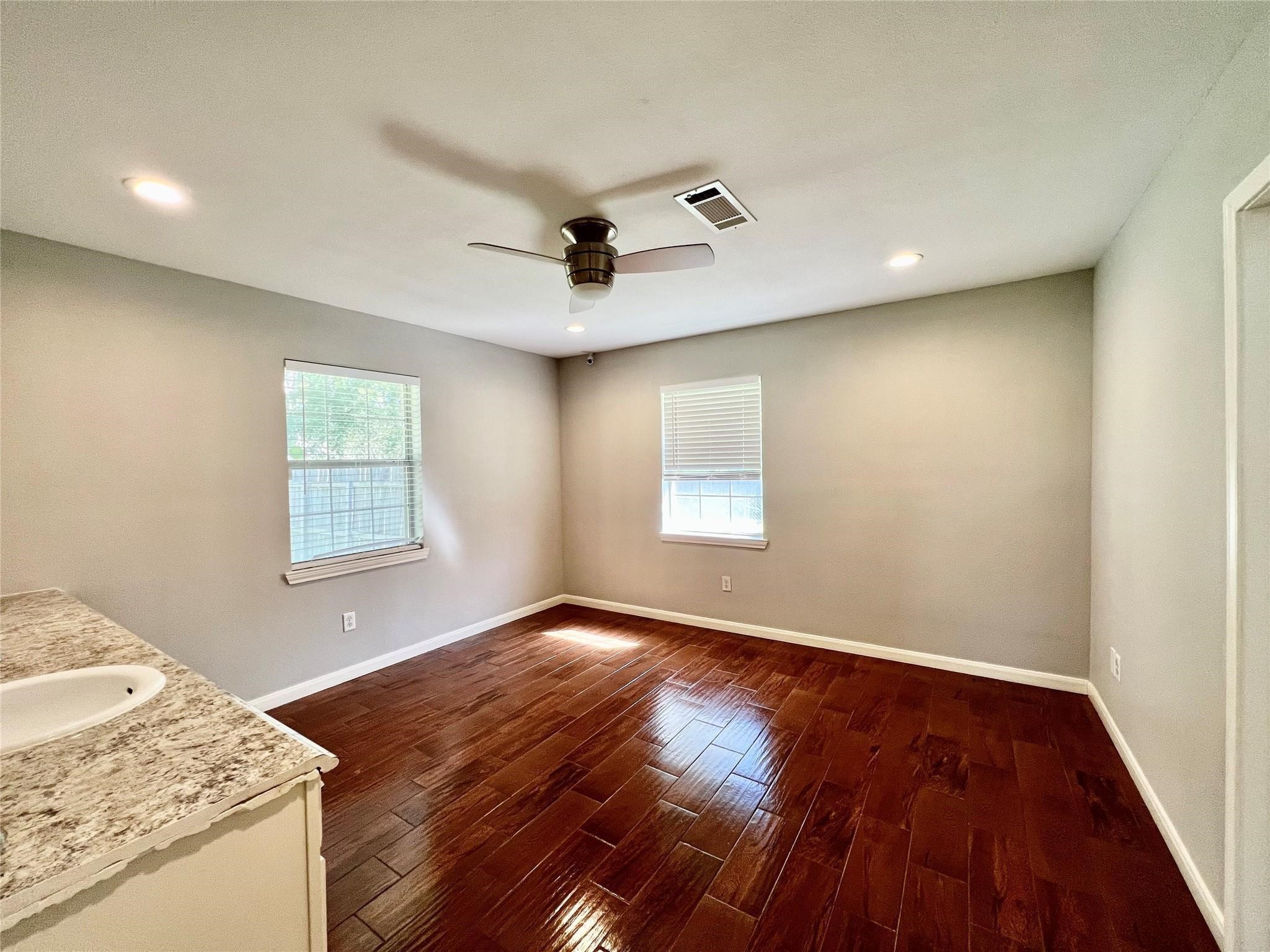 5302 Treaschwig Road Spring, TX 77373 - Photo 8 of 41 a view of a livingroom with a dishwasher and wooden floor