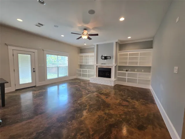 a view of livingroom with hardwood floor and a ceiling fan