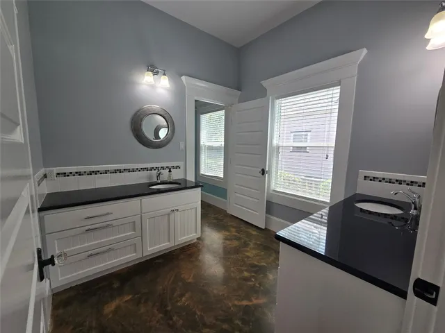 a kitchen with a stove cabinets and a refrigerator
