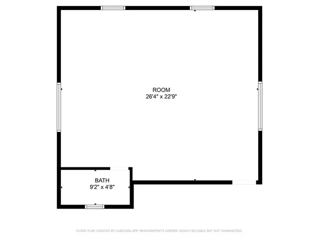 an aerial view of a house with a yard and trees