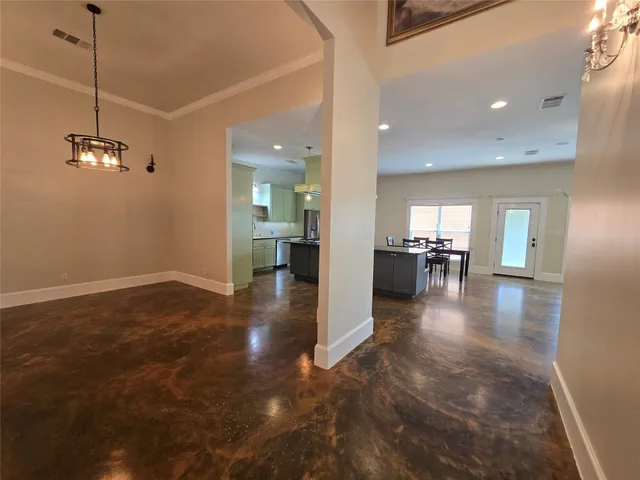 a view of a living room and kitchen view
