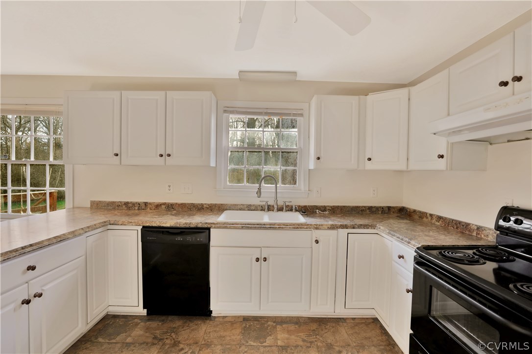 4601 Treely Road Chester, VA 23831 - Photo 12 of 27 a kitchen with granite countertop white cabinets and a stove top oven