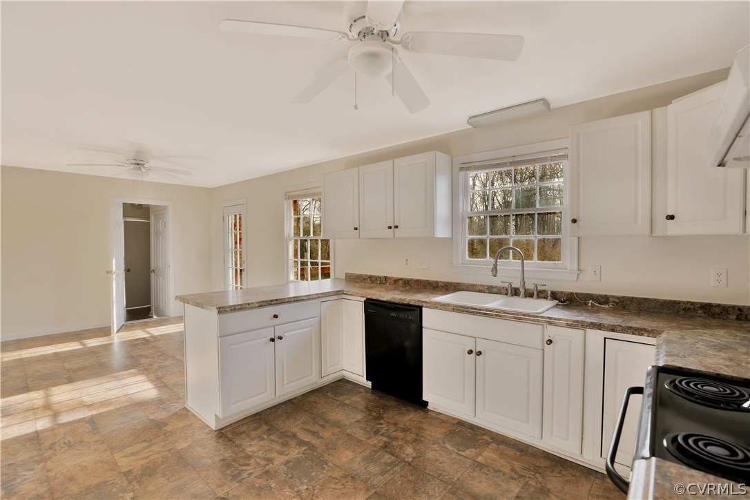 4601 Treely Road Chester, VA 23831 - Photo 13 of 27 a kitchen with a sink stove and cabinets