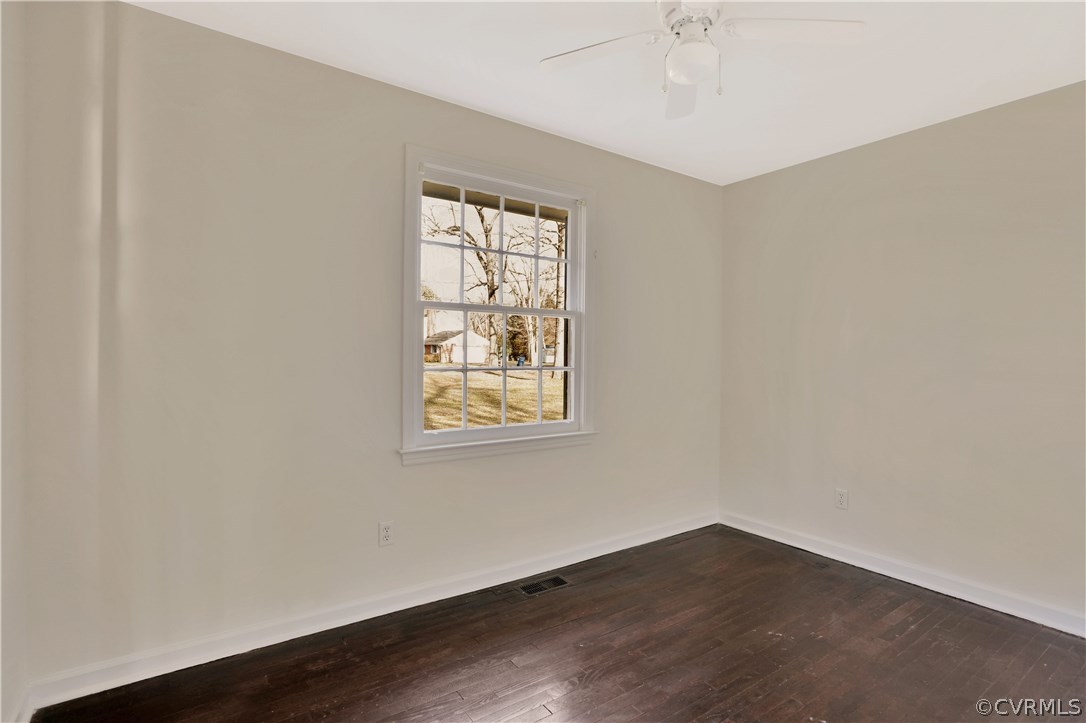 4601 Treely Road Chester, VA 23831 - Photo 16 of 27 an empty room with wooden floor and windows
