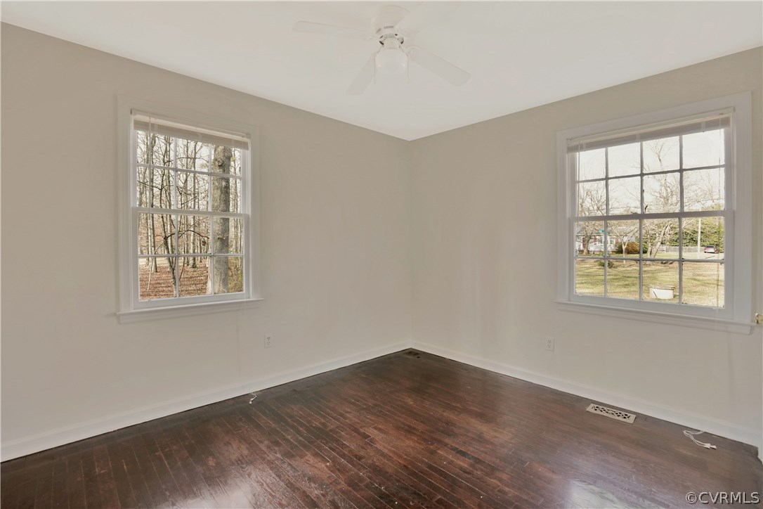 4601 Treely Road Chester, VA 23831 - Photo 17 of 27 a view of an empty room with wooden floor and a window